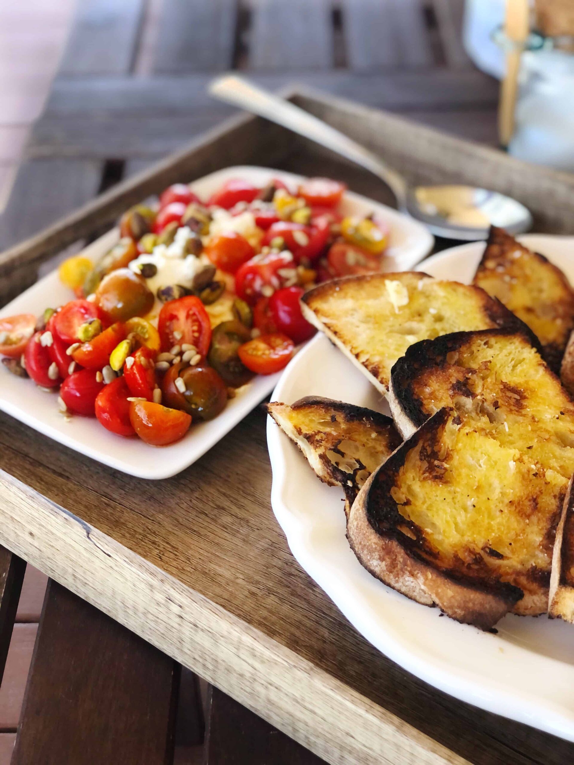 ricotta and tomato salad outside on table