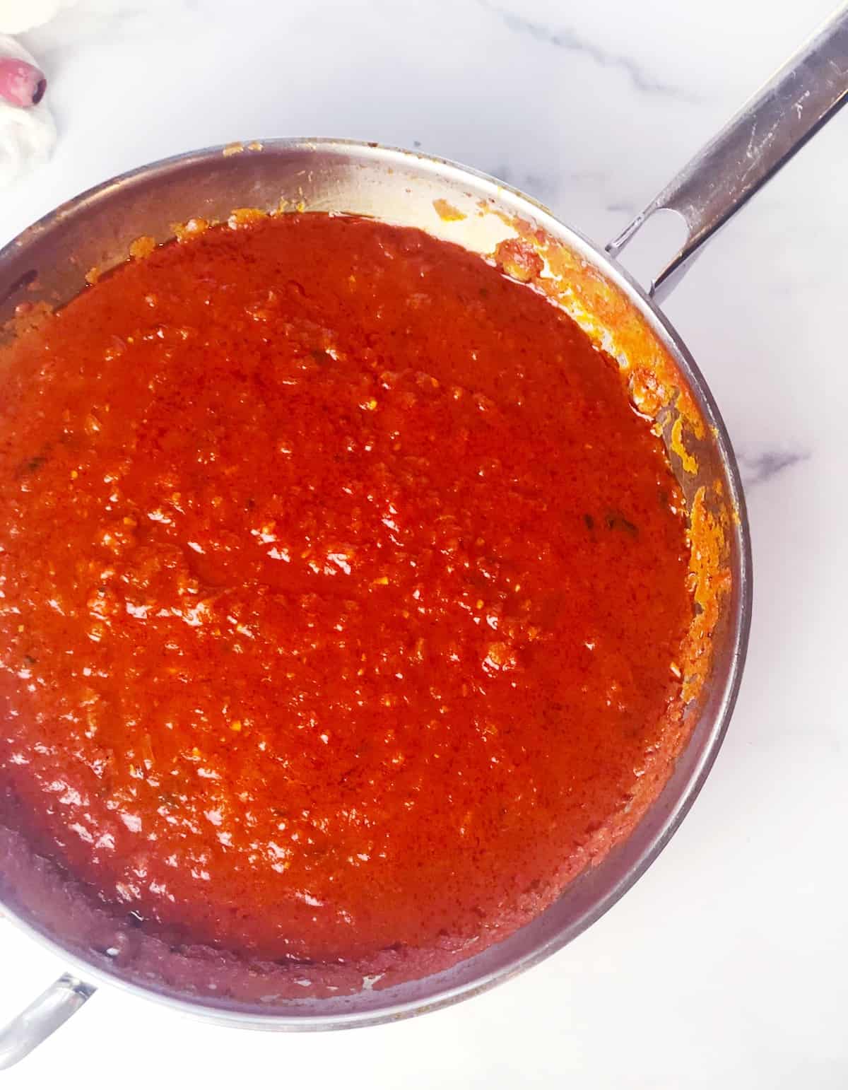Homemade red sauce in large pan