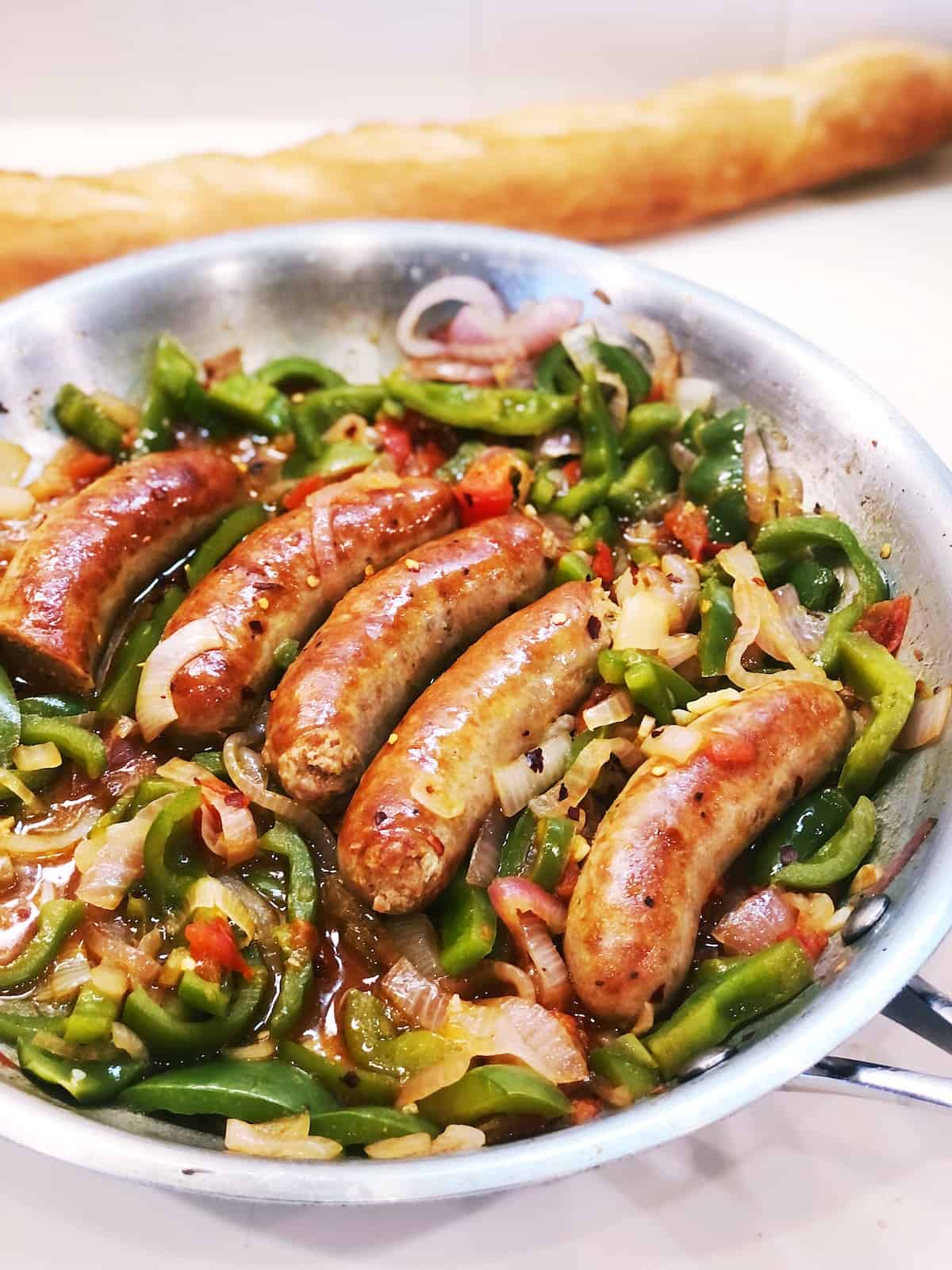 sausage and peppers in skillet
