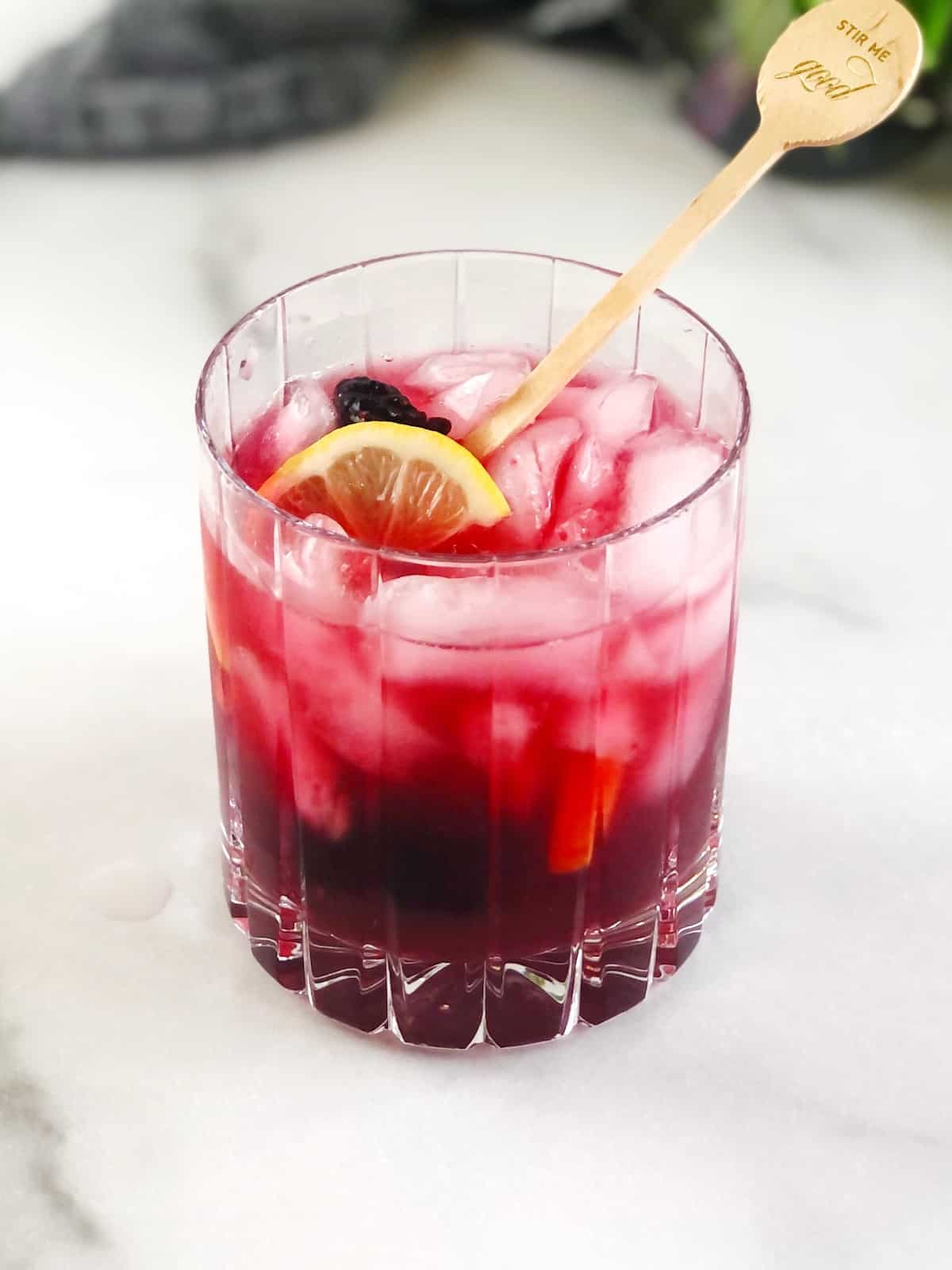 bramble cocktail in glass on table.