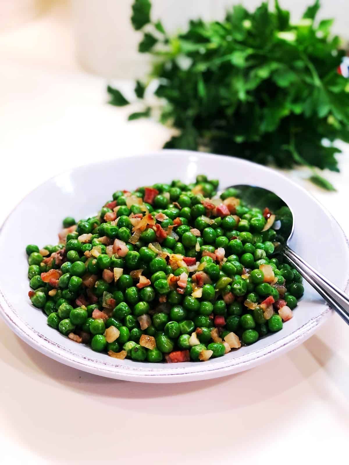 Peas with bacon and parsley.