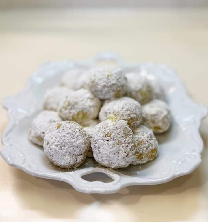 Eggnog spiced snowball cookies on a plate.