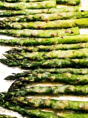 Garlic roasted Parmesan asparagus closeup in the pan.