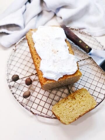 Nutmeg loaf cake with sour cream honey topping.