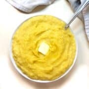 Mashed up acorn squash in a bowl.