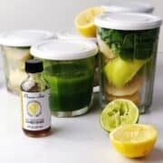 Green juice ingredients in working jars with lids.