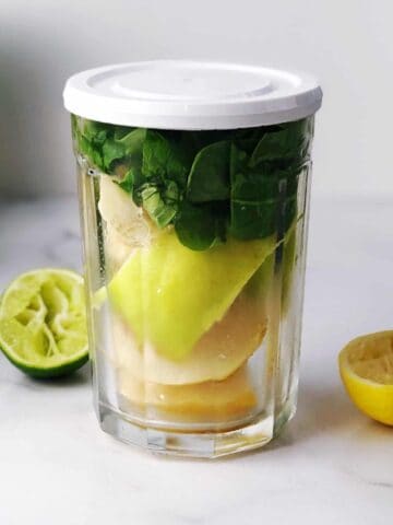 Green juice ingredients in a glass.