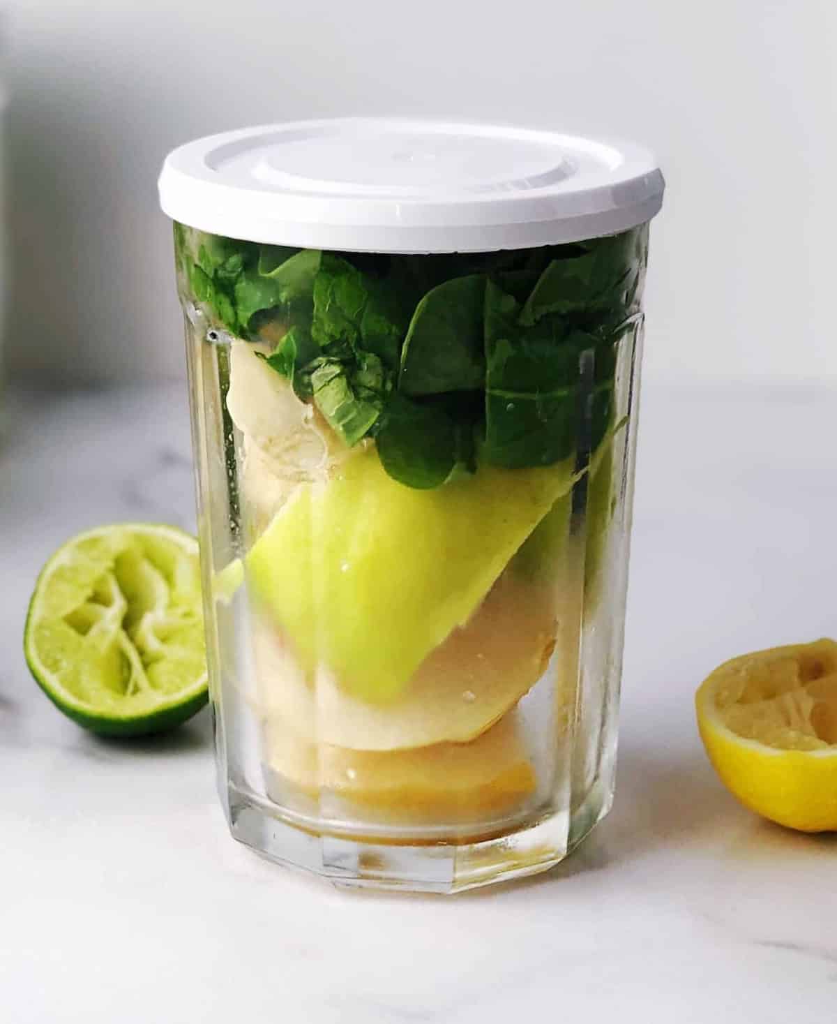 Green juice ingredients in a glass.